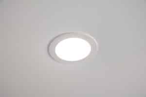 A round, recessed ceiling light is turned on, emitting bright white lighting. The IC rating ensures the fixture is safely installed in the smooth, plain white ceiling. | High 5 Plumbing, Heating & Cooling